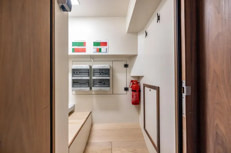 Wild Thing Yacht Photos Pics Electrical control room with panels and fire extinguisher on Explorer NG 50 Alu Fast Going, 2016.