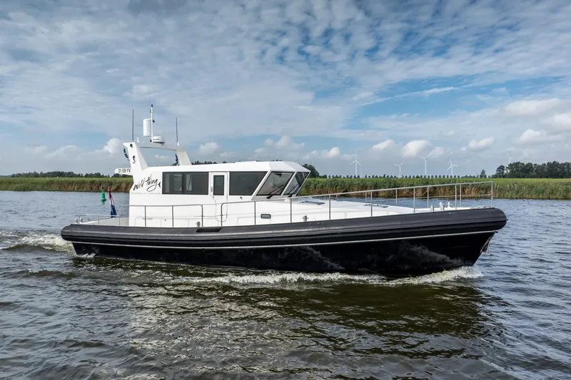 Wild Thing Yacht Photos Pics Explorer NG 50 Alu Fast Going 2016 boat cruising on a scenic waterway.