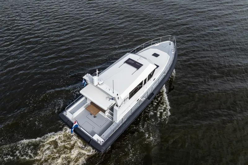 Wild Thing Yacht Photos Pics Explorer NG 50 Alu Fast Going 2016 boat cruising on open water, aerial view.