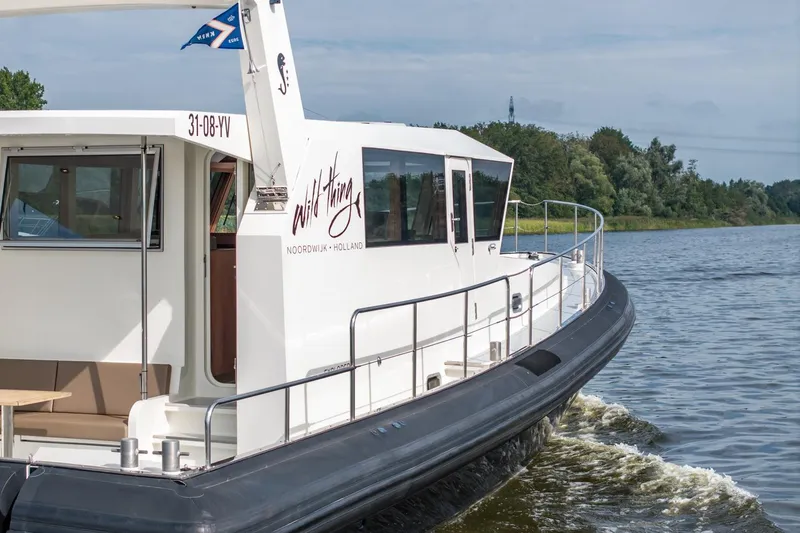 Wild Thing Yacht Photos Pics 2016 Explorer NG 50 Alu Fast Going boat cruising on a scenic river.