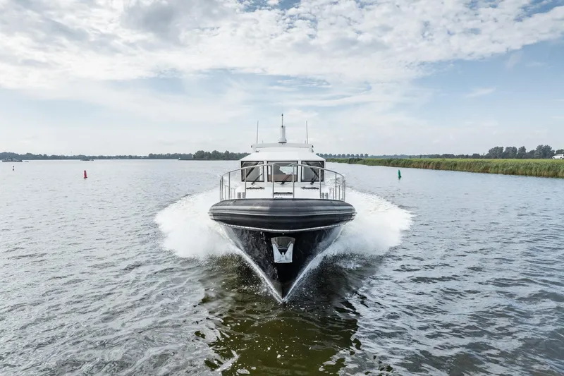 Wild Thing Yacht Photos Pics 2016 Explorer NG 50 Alu Fast Going boat cruising on a calm waterway.