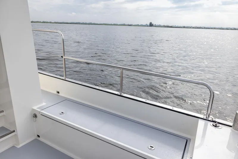 Wild Thing Yacht Photos Pics Explorer NG 50 Alu Fast Going boat deck overlooking serene water, 2016 model.