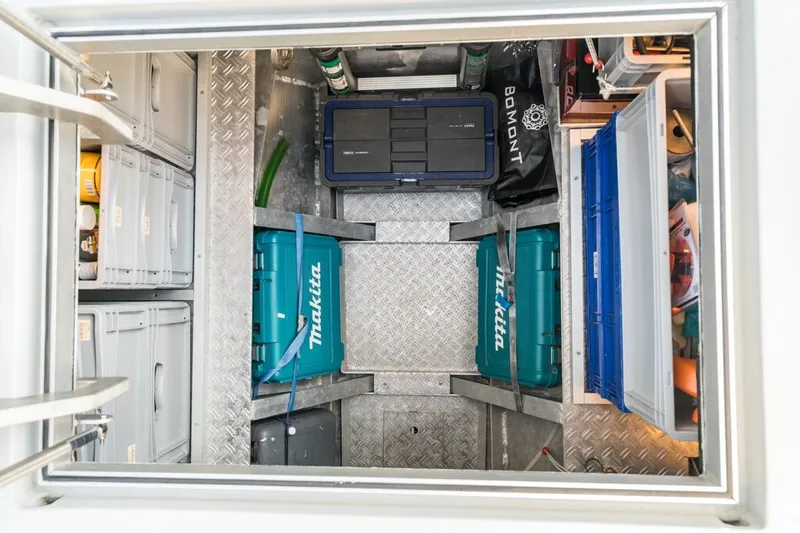 Wild Thing Yacht Photos Pics Storage compartment with organized toolboxes and containers in a 2016 Explorer NG 50 Alu Fast Going.