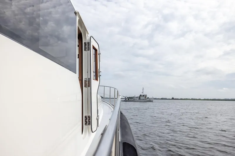 Wild Thing Yacht Photos Pics Explorer NG 50 Alu Fast Going yacht on calm waters, 2016 model, overcast sky.
