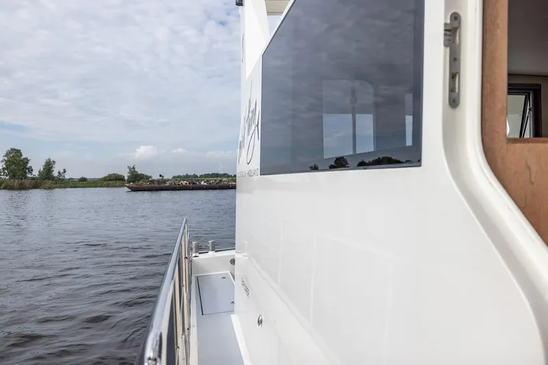 Wild Thing Yacht Photos Pics Explorer NG 50 Alu Fast Going yacht on a serene waterway, 2016 model.