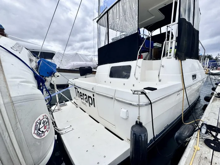  Yacht Photos Pics 1998 Bayliner 4087 Aft Cabin Motoryacht docked, featuring spacious aft deck and protective covers.