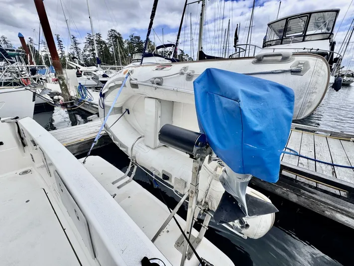  Yacht Photos Pics 1998 Bayliner 4087 Aft Cabin Motoryacht docked with inflatable dinghy on deck.