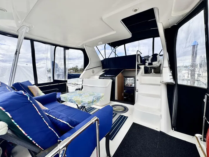  Yacht Photos Pics 1998 Bayliner 4087 Aft Cabin Motoryacht interior with blue seating and helm station.