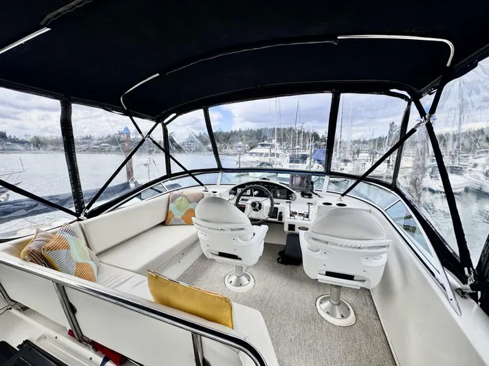  Yacht Photos Pics 1998 Bayliner 4087 Aft Cabin Motoryacht interior with helm, seating, and marina view.