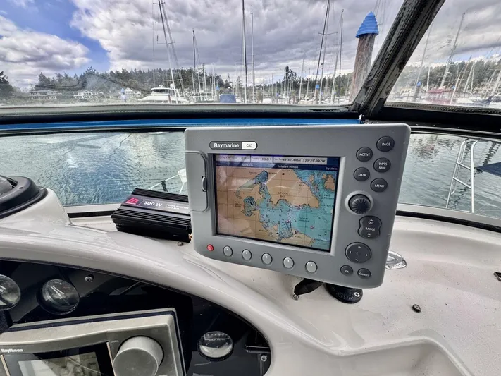  Yacht Photos Pics 1998 Bayliner 4087 Aft Cabin Motoryacht helm with navigation system, docked in a marina.