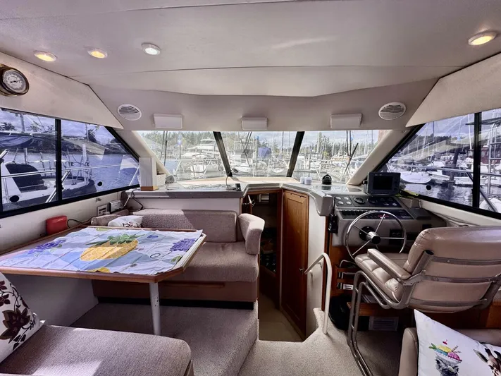  Yacht Photos Pics 1998 Bayliner 4087 Aft Cabin Motoryacht interior with helm, seating, and marina view.