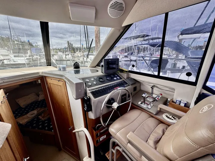  Yacht Photos Pics 1998 Bayliner 4087 Aft Cabin Motoryacht helm with leather seat and navigation controls.
