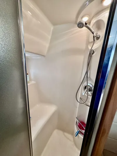  Yacht Photos Pics 1998 Bayliner 4087 Aft Cabin Motoryacht shower with modern fixtures and compact design.
