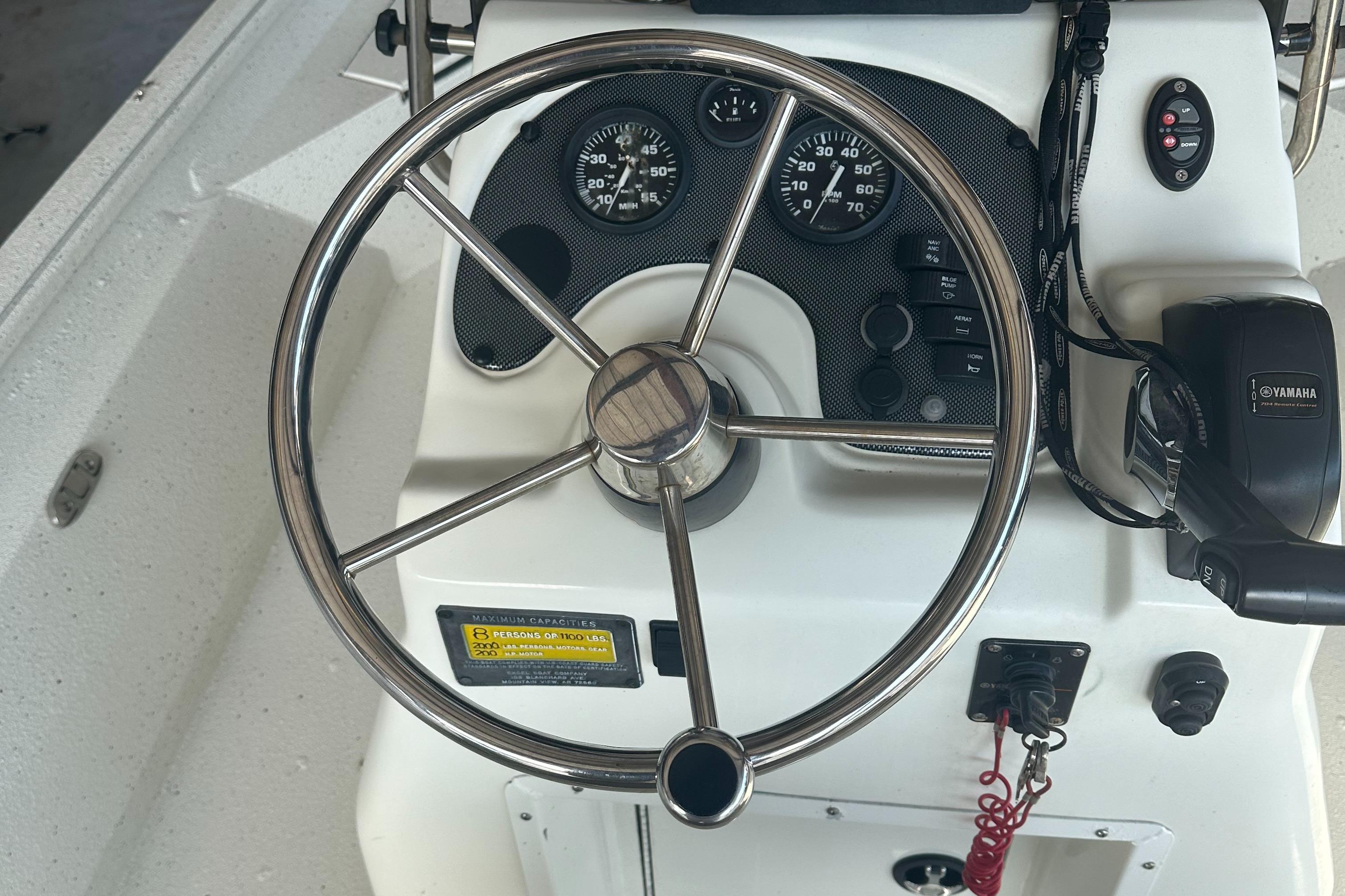 2018 Excel 220 Bay Pro boat steering wheel and dashboard controls.
