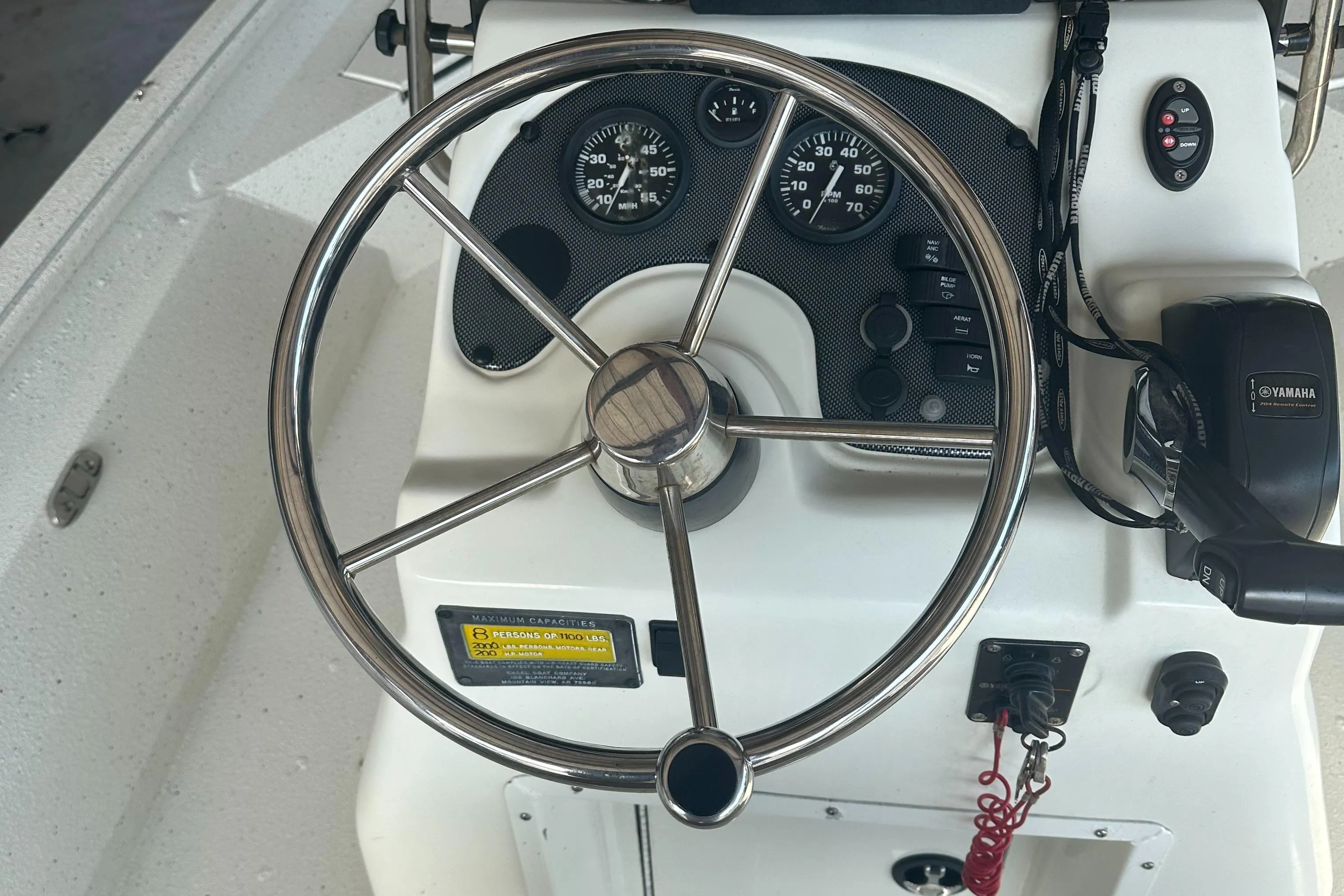2018 Excel 220 Bay Pro boat steering wheel and dashboard controls.