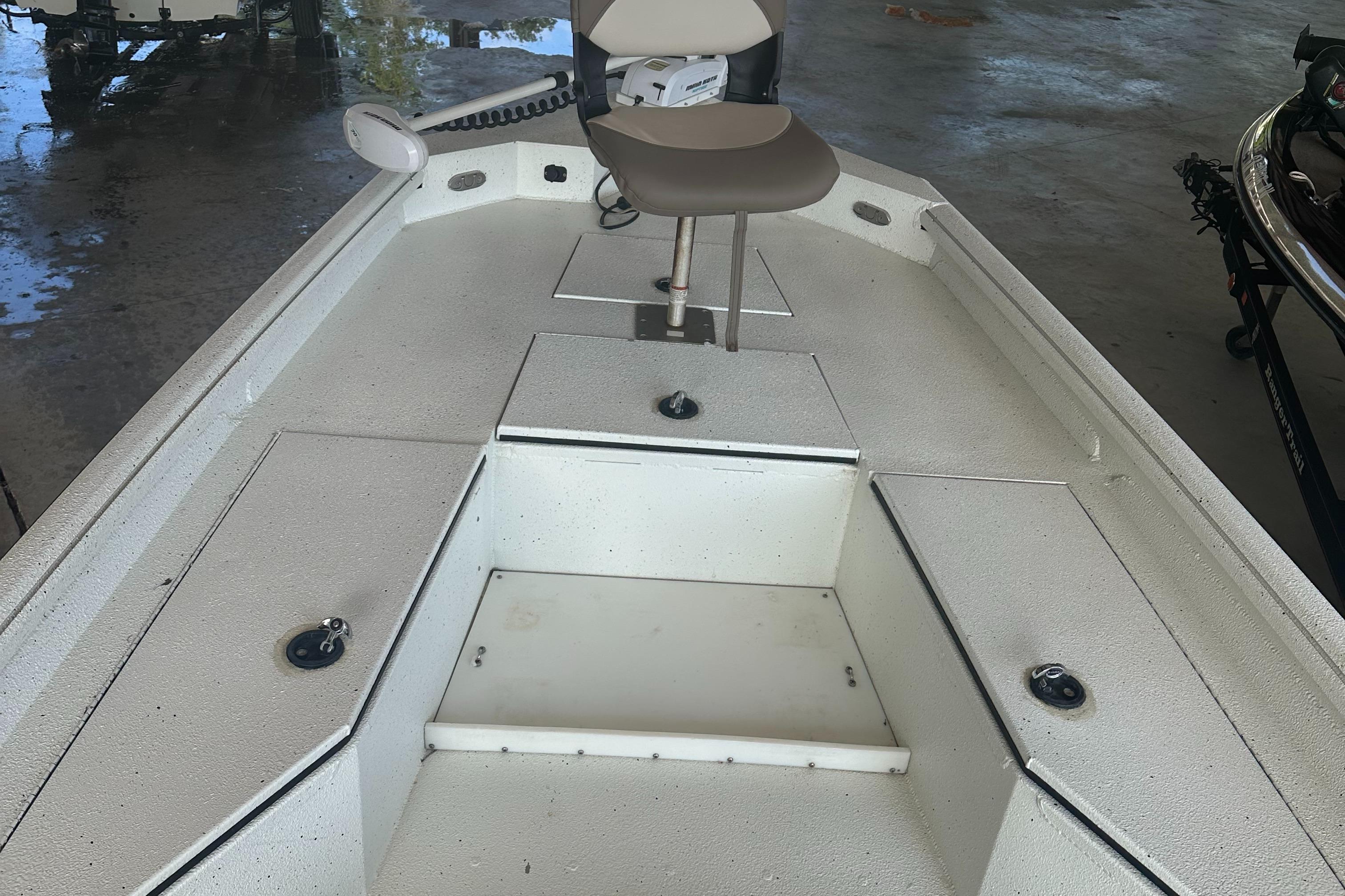 2018 Excel 220 Bay Pro boat interior with seating and storage compartments.