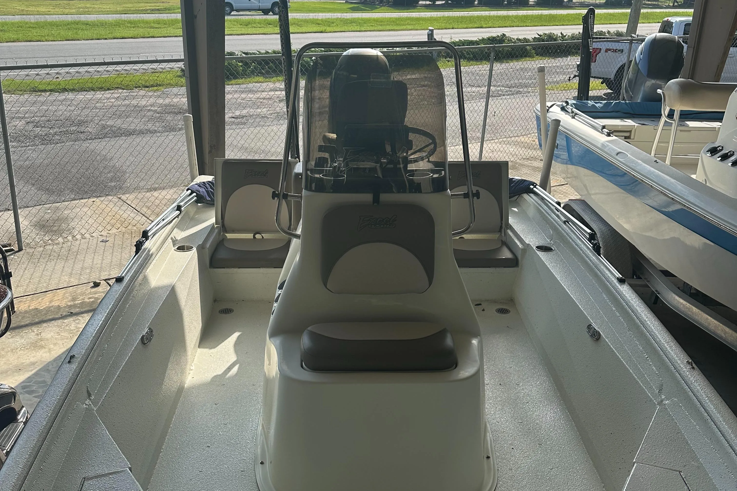 2018 Excel 220 Bay Pro boat interior with console and seating.