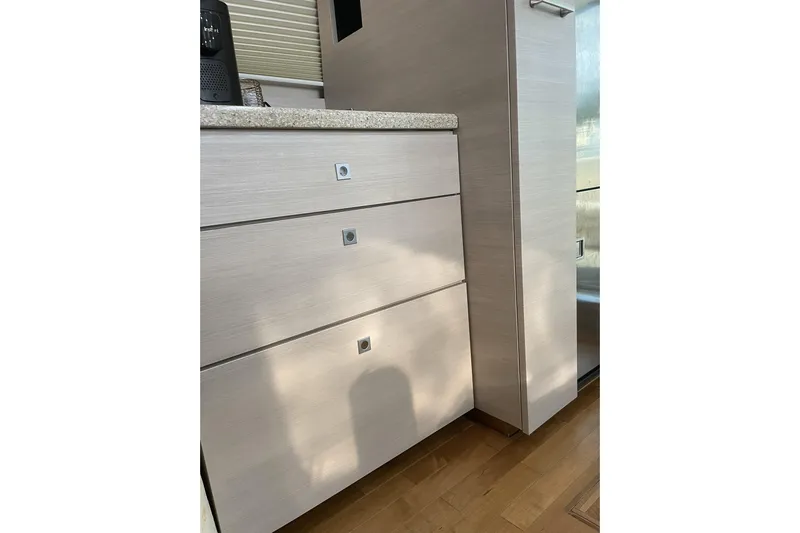 Shenanhiggins Yacht Photos Pics Interior cabinetry of a 2008 Sea Ray 47 Sedan Bridge yacht, featuring sleek, modern design.