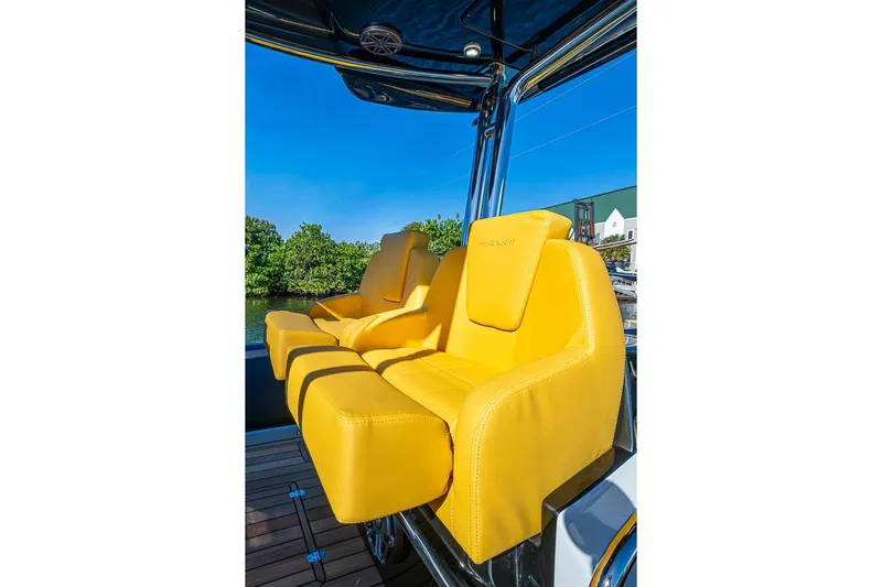  Yacht Photos Pics Yellow seats on 2025 SACS Strider 11 boat, under clear blue sky.