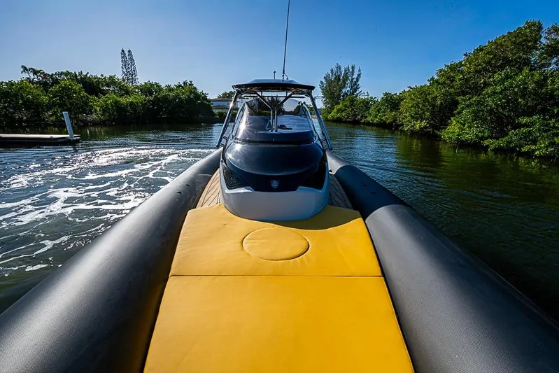  Yacht Photos Pics 2025 SACS Strider 11 boat cruising on a sunny day, featuring a sleek design.