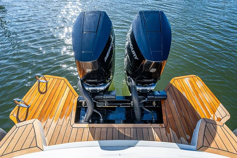  Yacht Photos Pics 2025 SACS Strider 11 with dual Mercury outboard engines on teak deck.