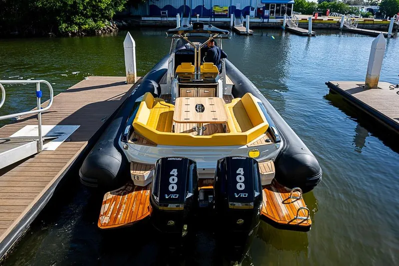  Yacht Photos Pics 2025 SACS Strider 11 boat docked, featuring dual Mercury 400 V10 engines.