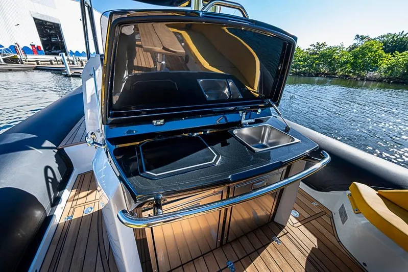  Yacht Photos Pics 2025 SACS Strider 11 yacht with sleek outdoor kitchen and scenic water view.