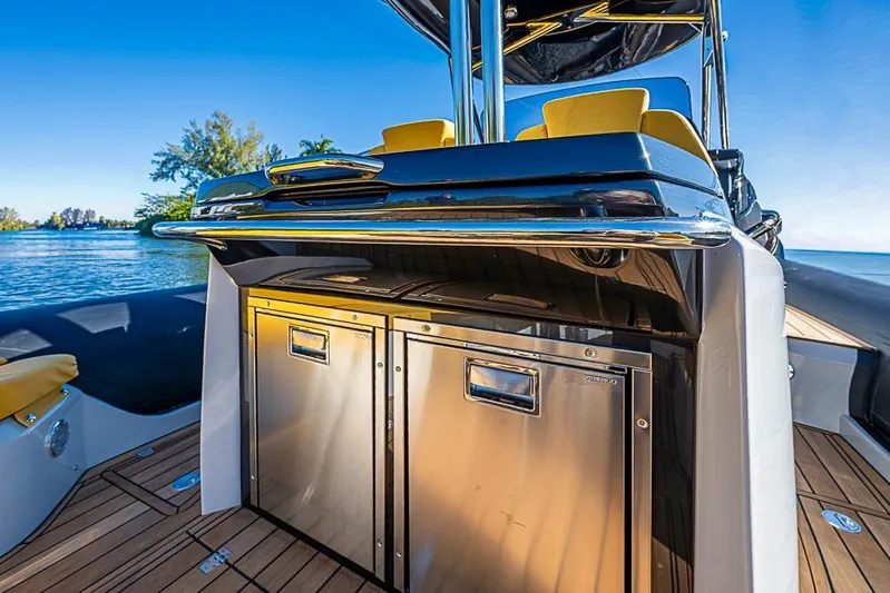  Yacht Photos Pics 2025 SACS Strider 11 yacht interior with stainless steel appliances and luxurious seating.