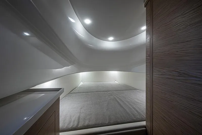  Yacht Photos Pics Interior cabin of 2025 SACS Strider 11 with modern lighting and wood accents.