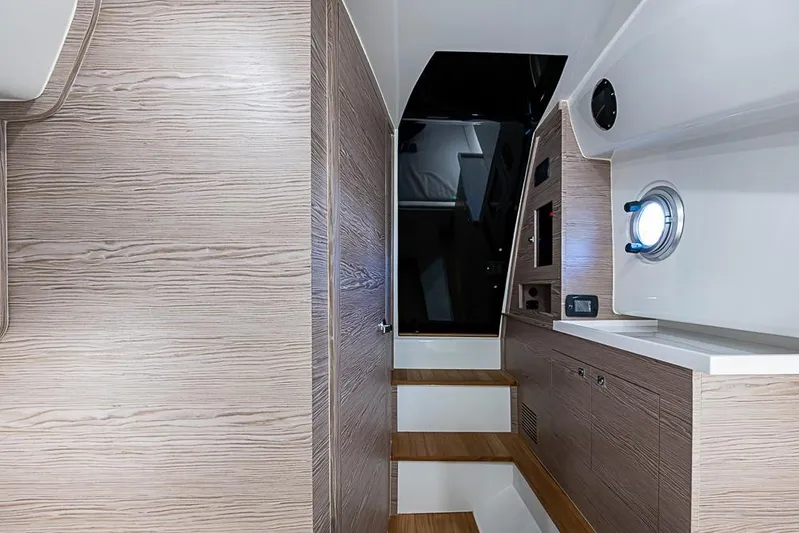  Yacht Photos Pics Interior of 2025 SACS Strider 11 yacht with modern wood paneling and sleek design.