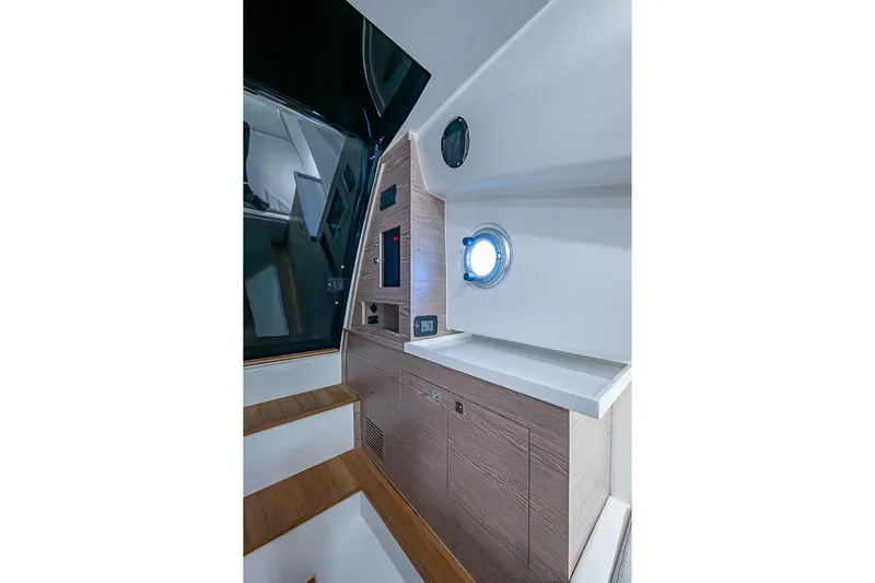  Yacht Photos Pics Interior of 2025 SACS Strider 11 yacht, featuring modern design and porthole window.