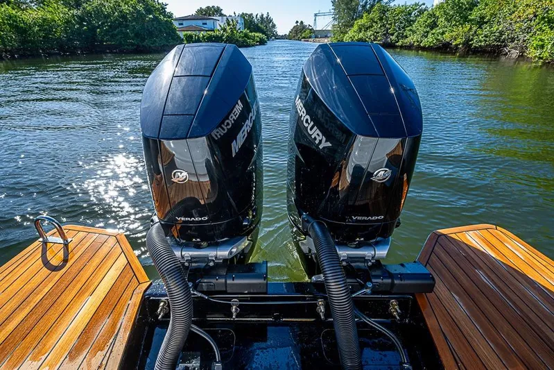  Yacht Photos Pics 2025 SACS Strider 11 with dual Mercury Verado engines on a sunny waterway.