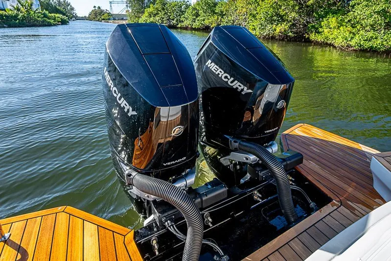  Yacht Photos Pics 2025 SACS Strider 11 with dual Mercury Verado engines on a wooden deck.