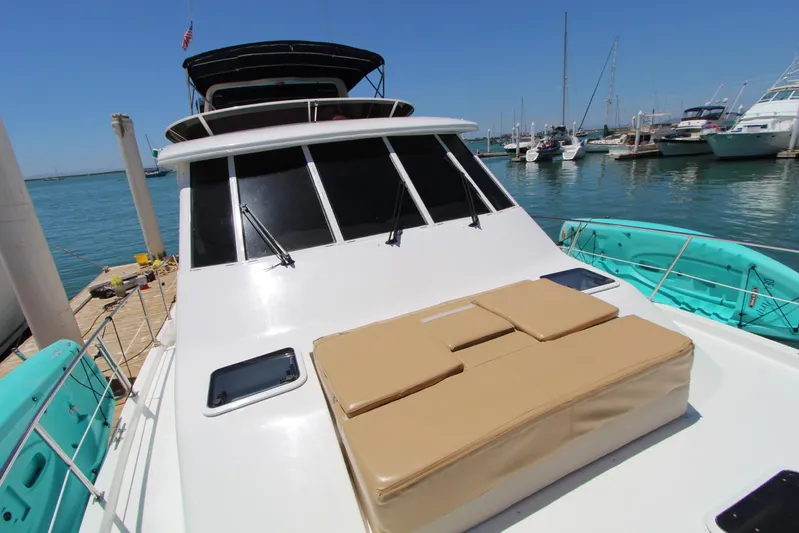  Yacht Photos Pics 2000 Bayliner 4788 Pilothouse Motoryacht docked in marina, sunny day.