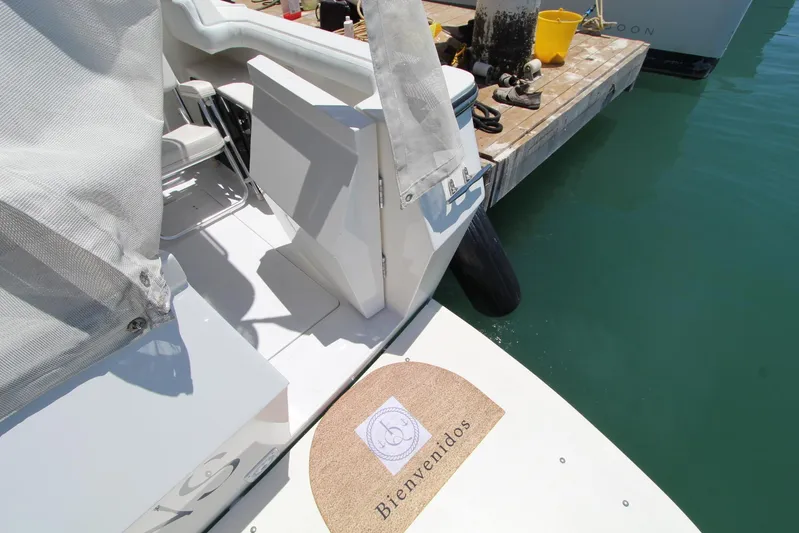  Yacht Photos Pics Bayliner 4788 Pilothouse Motoryacht 2000 at dock with welcome mat, sunny day.