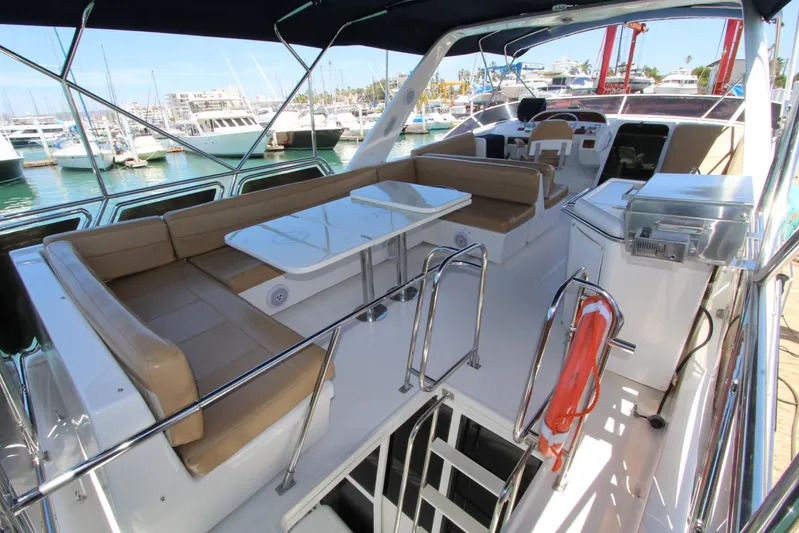  Yacht Photos Pics 2000 Bayliner 4788 Pilothouse Motoryacht with spacious deck and seating in marina.