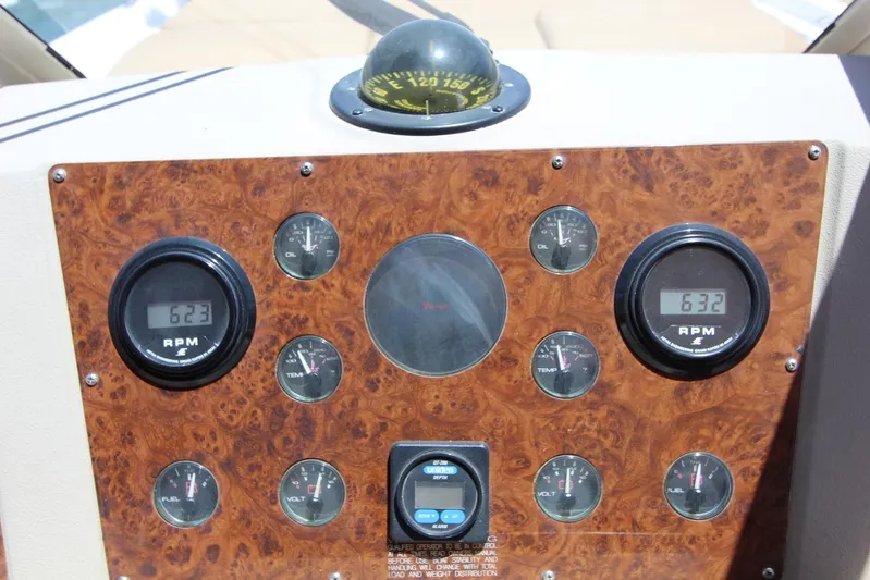  Yacht Photos Pics Dashboard of 2000 Bayliner 4788 Pilothouse Motoryacht with RPM gauges and compass.