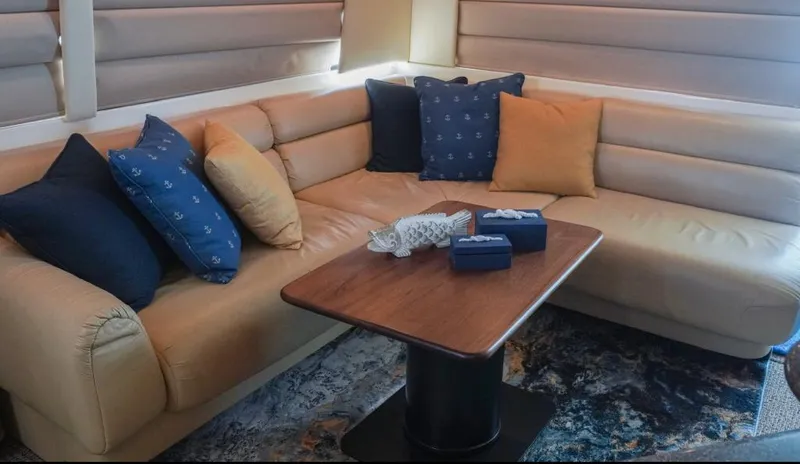  Yacht Photos Pics Luxurious interior of 2000 Bayliner 4788 Pilothouse Motoryacht with plush seating and cushions.