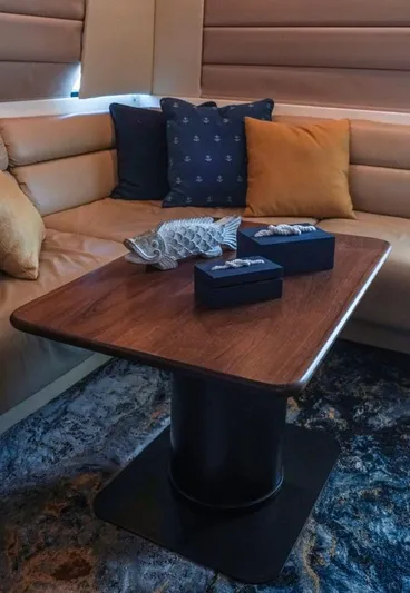  Yacht Photos Pics Luxurious interior of 2000 Bayliner 4788 Pilothouse Motoryacht with elegant table and cushions.