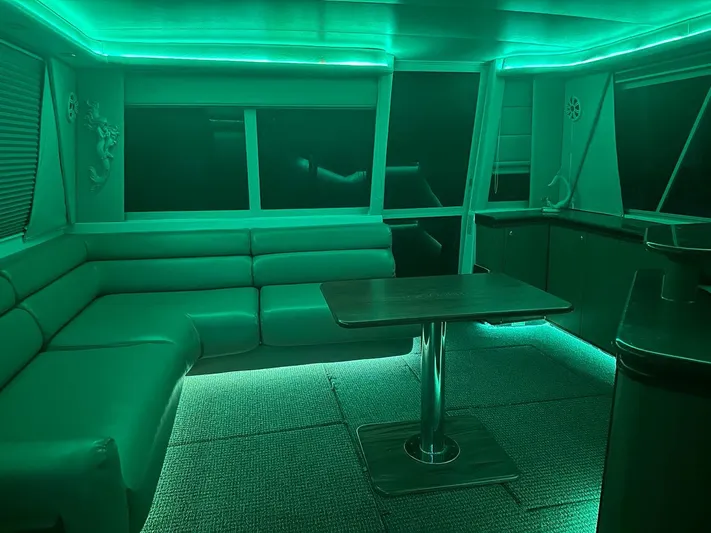  Yacht Photos Pics Luxurious interior of 2000 Bayliner 4788 Pilothouse Motoryacht with ambient green lighting.
