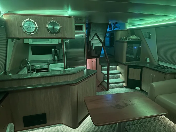  Yacht Photos Pics Interior of 2000 Bayliner 4788 Pilothouse Motoryacht with modern kitchen and ambient lighting.
