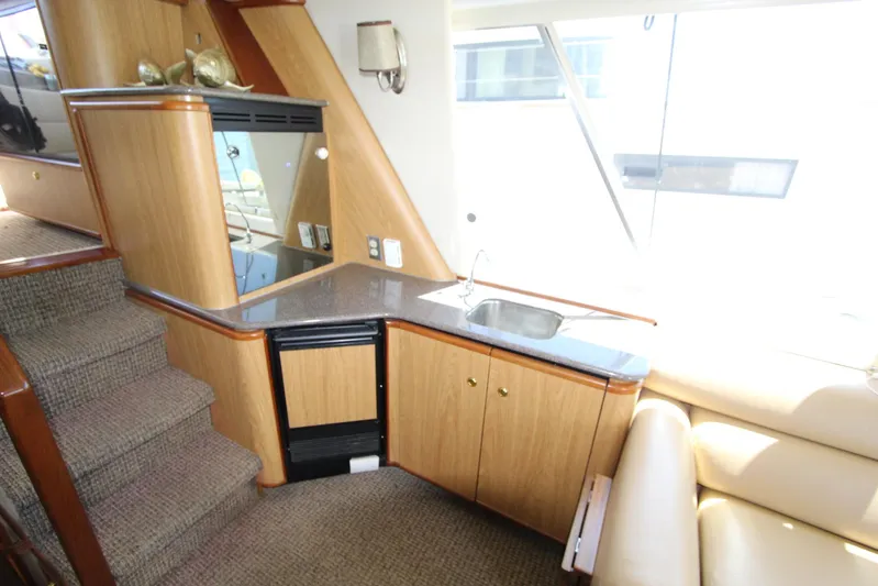  Yacht Photos Pics Interior of 2000 Bayliner 4788 Pilothouse Motoryacht with kitchenette and stairs.