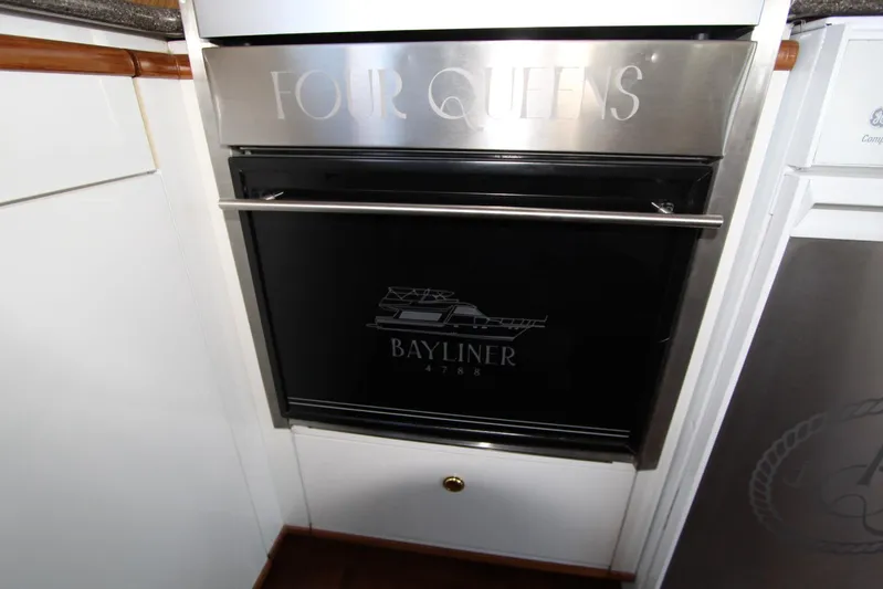  Yacht Photos Pics Bayliner 4788 Pilothouse Motoryacht 2000 kitchen oven with logo and sleek design.