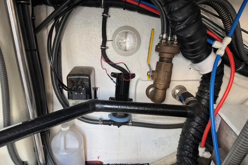  Yacht Photos Pics Engine compartment of a 2003 Formula 37 Performance Cruiser with various hoses and components.