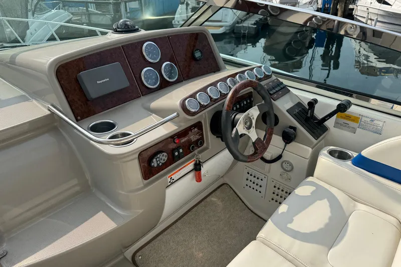  Yacht Photos Pics 2003 Formula 37 Performance Cruiser helm with gauges, steering wheel, and controls.