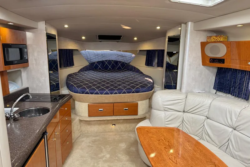  Yacht Photos Pics Luxurious interior of a 2003 Formula 37 Performance Cruiser with cozy seating and modern amenities.