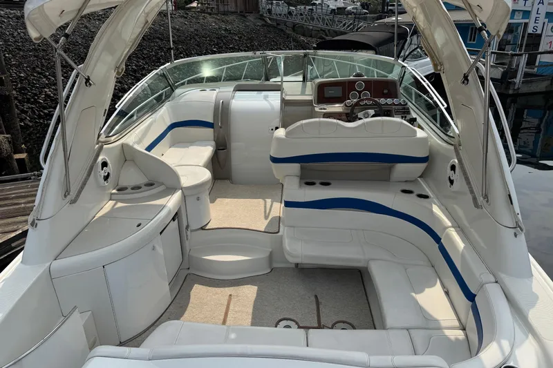  Yacht Photos Pics 2003 Formula 37 Performance Cruiser interior with white and blue seating, docked at marina.