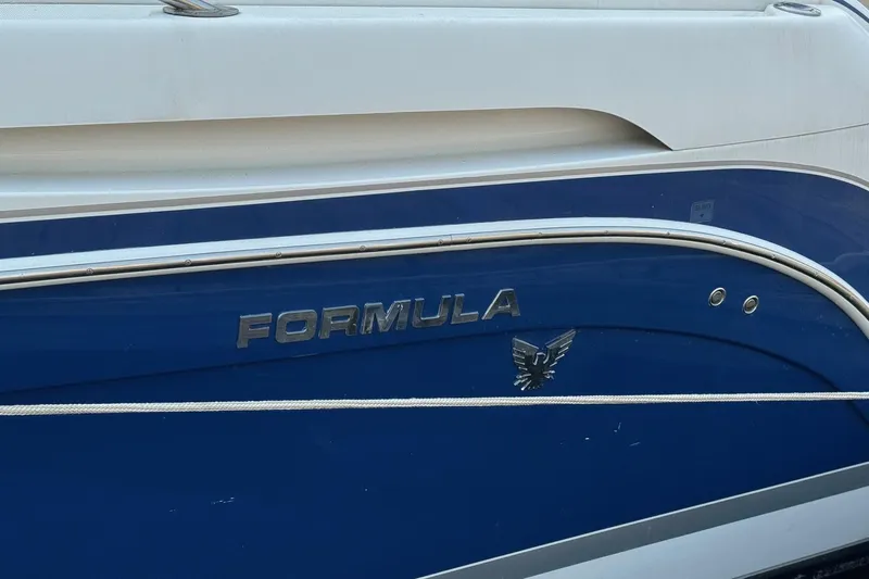 Yacht Photos Pics 2003 Formula 37 Performance Cruiser boat, blue and white exterior with logo.
