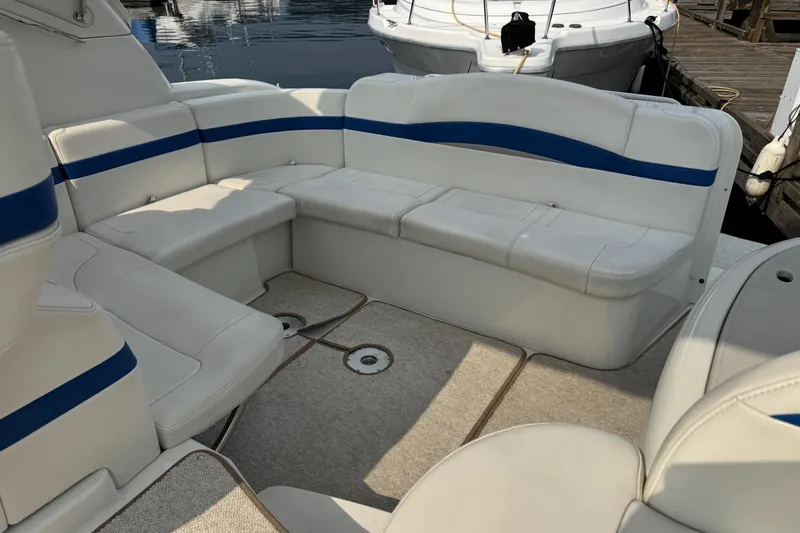  Yacht Photos Pics 2003 Formula 37 Performance Cruiser interior with white and blue seating, docked at marina.