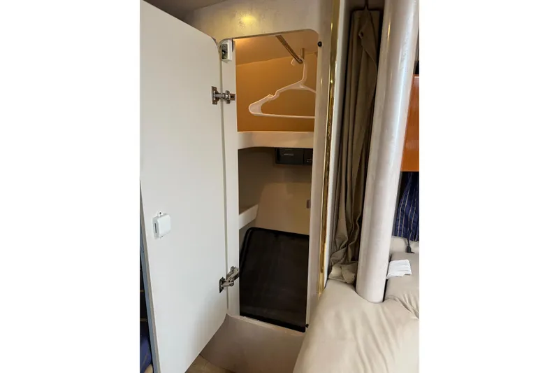  Yacht Photos Pics 2003 Formula 37 Performance Cruiser interior closet with open door and hanger.